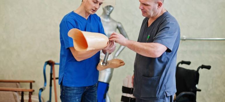 Physiotherapist guiding a patient through fracture recovery exercises.