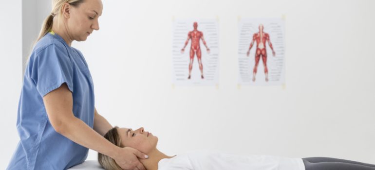 Physiotherapist guiding a patient through neck stretching exercises